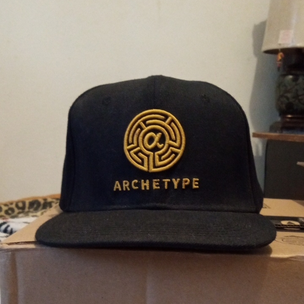 Black Snapback Hat W/ Archetype In Gold On The Front & Ventura Cigars  On The Ba